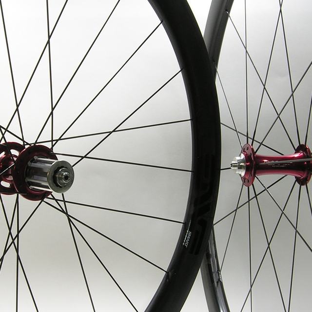 Custom wheel: Chris King R45 Red hubs, ENVE Smart 3.4 Black rims, Sapim CX-Ray Black spokes