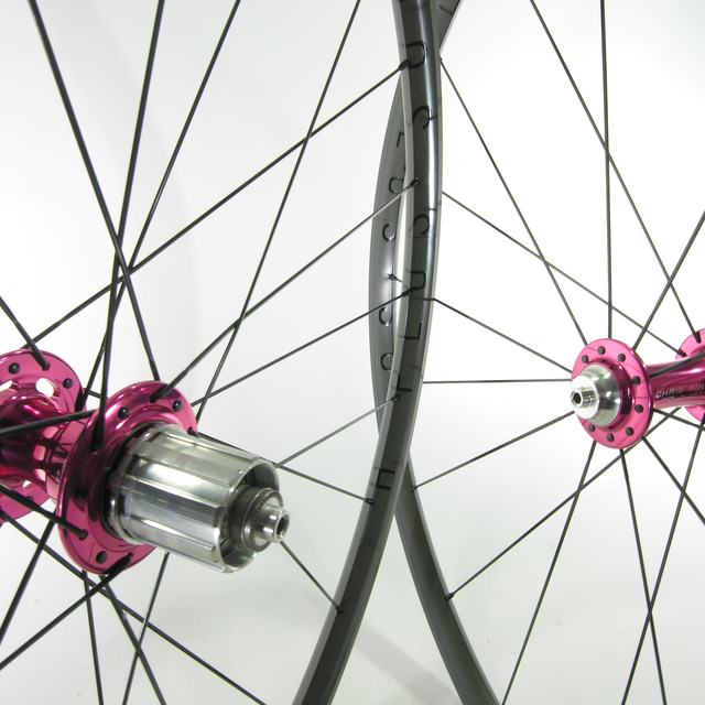 Custom wheel: Chris King R45 Pink hubs, H Plus Son Archetype Gray rims, Sapim CX-Ray Black spokes