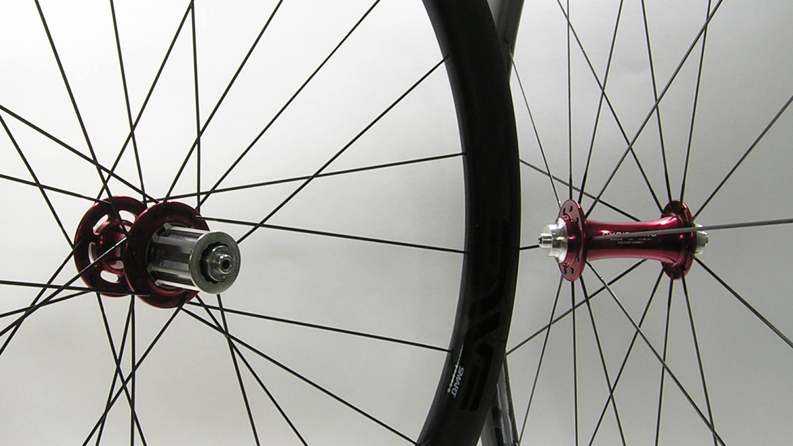 Custom wheel built by ProWheelBuilder: Chris King R45 Red hubs, ENVE Smart 3.4 Black rims